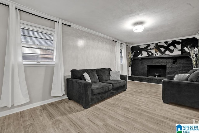 living room featuring a brick fireplace, light hardwood / wood-style floors, and ornamental molding