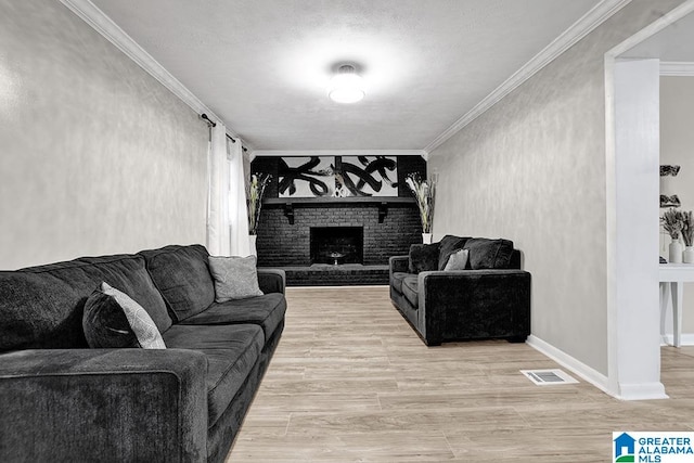 living room featuring a fireplace, hardwood / wood-style floors, and ornamental molding