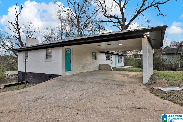 view of front of property with a carport