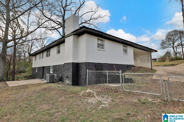 view of side of property featuring central AC unit