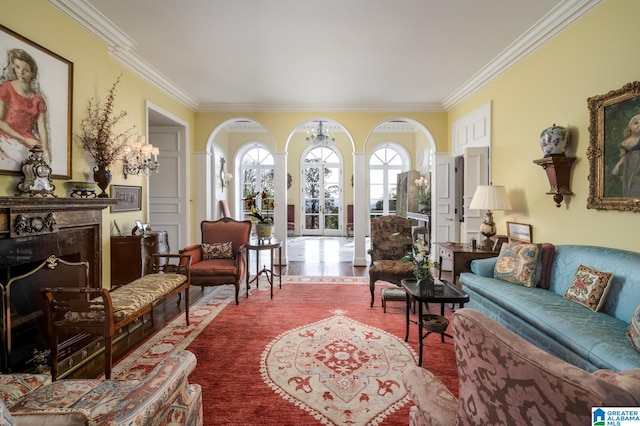 living room featuring wood-type flooring, an inviting chandelier, and ornamental molding