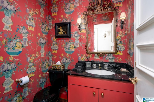 bathroom with vanity and toilet