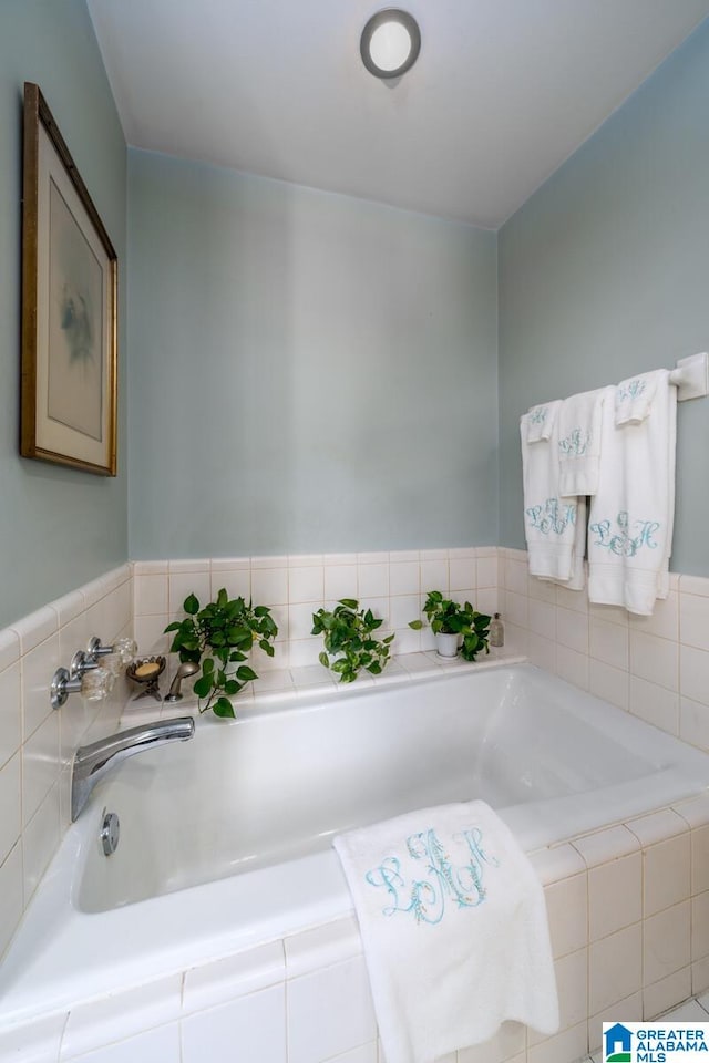 bathroom with tiled bath