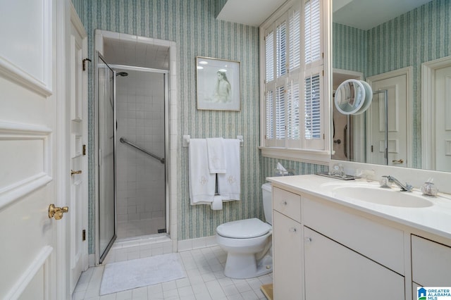 bathroom featuring tile patterned flooring, vanity, toilet, and an enclosed shower