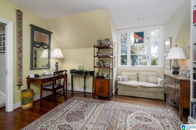 interior space featuring dark hardwood / wood-style floors and vaulted ceiling