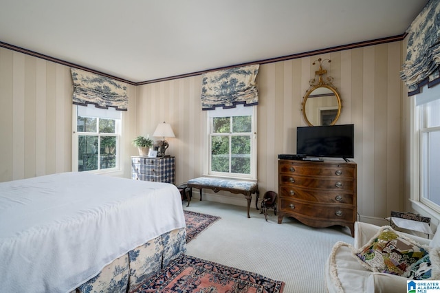 carpeted bedroom featuring crown molding