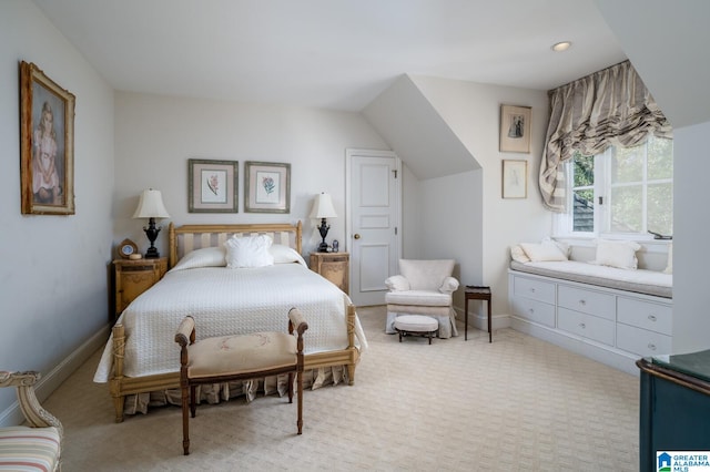 carpeted bedroom featuring vaulted ceiling