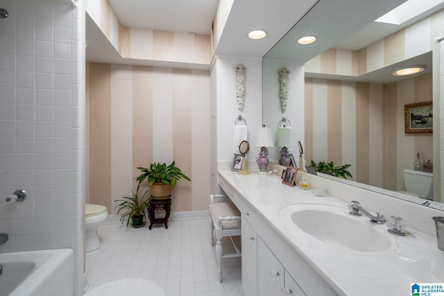 bathroom featuring tile patterned flooring, vanity, and toilet