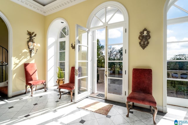 doorway to outside with french doors, a wealth of natural light, and crown molding