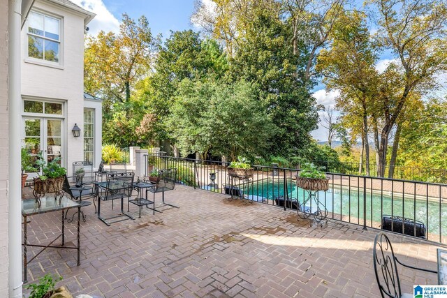 view of patio / terrace featuring a fenced in pool