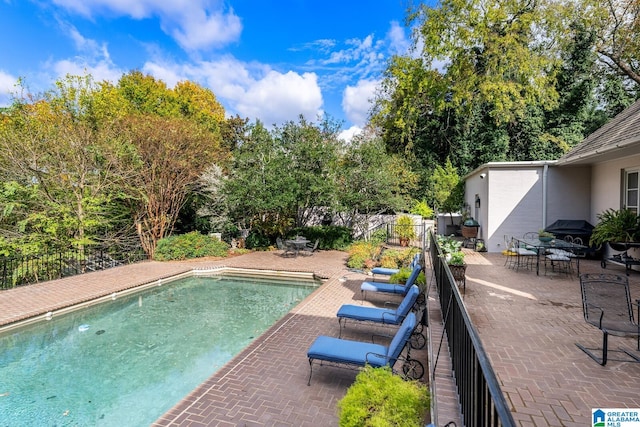 view of pool featuring a patio