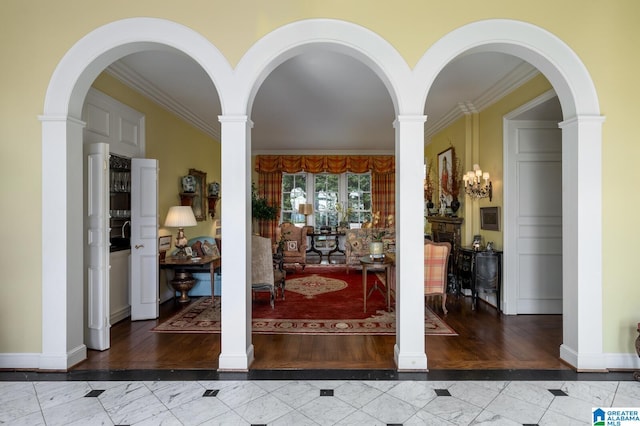 doorway to outside featuring ornamental molding and hardwood / wood-style flooring