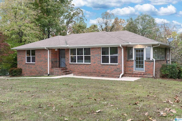 ranch-style house with a front yard