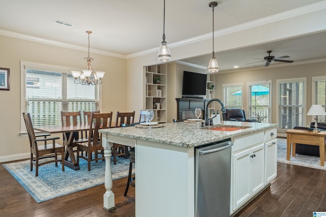 kitchen with white cabinetry, sink, dark wood-type flooring, light stone counters, and an island with sink