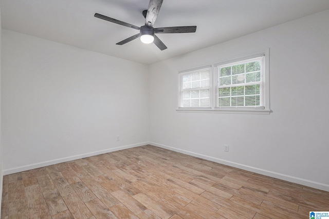 empty room featuring ceiling fan and light hardwood / wood-style floors