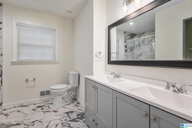 bathroom featuring vanity, curtained shower, and toilet