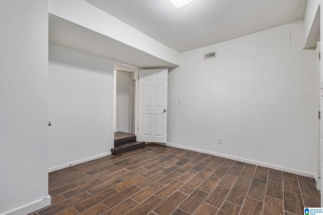 basement with dark hardwood / wood-style flooring