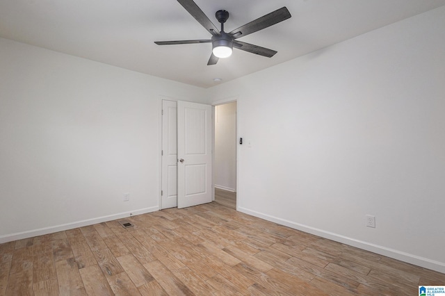 spare room with ceiling fan and light hardwood / wood-style flooring