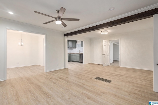 unfurnished living room featuring ceiling fan with notable chandelier, crown molding, and light hardwood / wood-style flooring