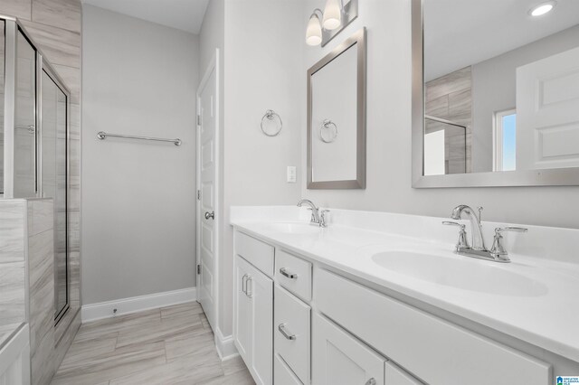 bathroom with vanity and an enclosed shower