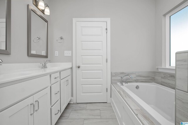 bathroom featuring a bathing tub and vanity