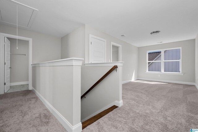 hallway featuring carpet floors