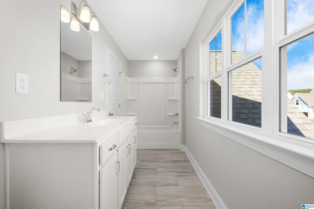 bathroom with vanity and shower / tub combination