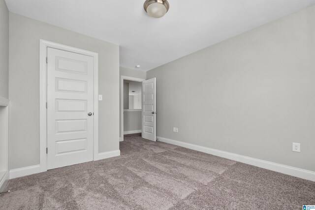 unfurnished bedroom featuring carpet flooring