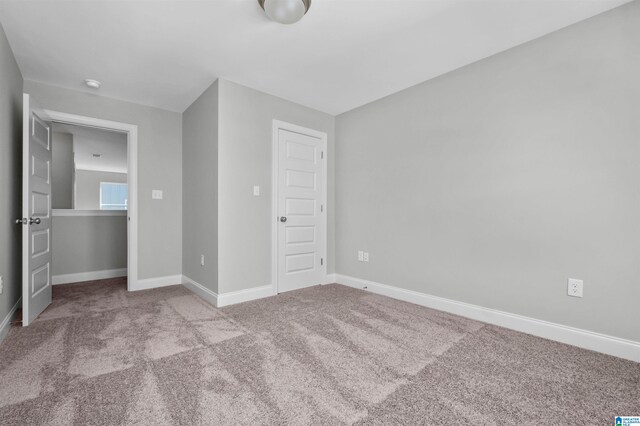 unfurnished bedroom featuring carpet floors