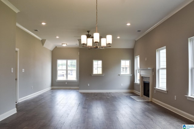 unfurnished living room featuring dark hardwood / wood-style flooring, crown molding, and plenty of natural light