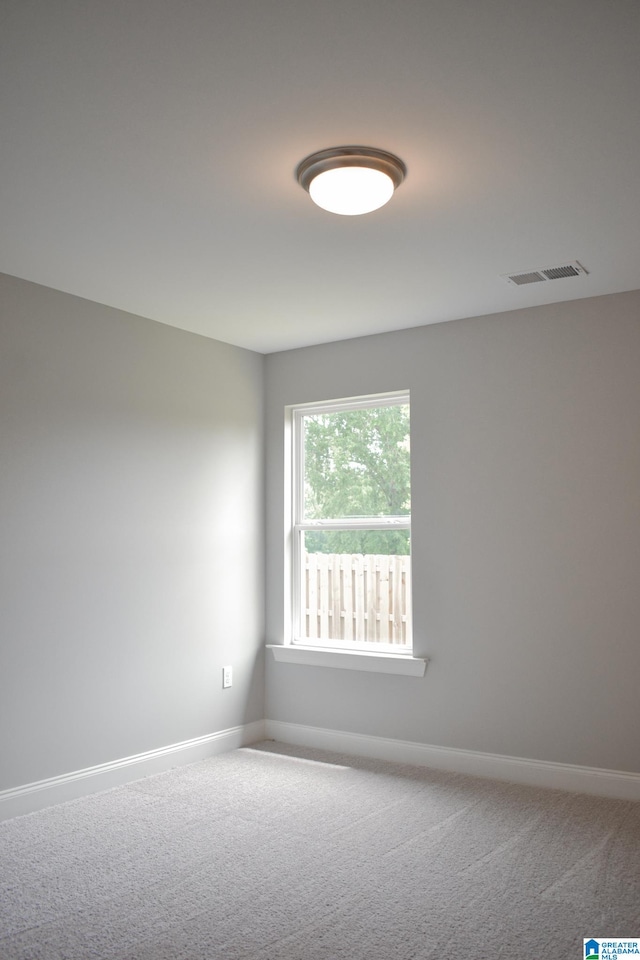 empty room featuring carpet flooring