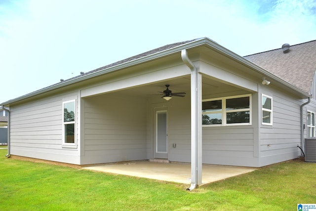 back of house featuring a lawn, a patio area, and ceiling fan