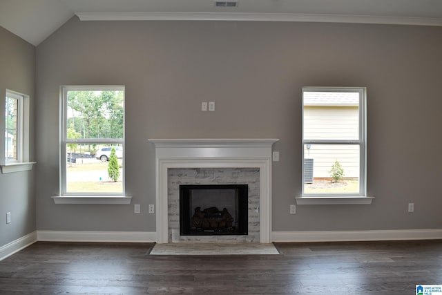 unfurnished living room with crown molding, dark hardwood / wood-style flooring, and lofted ceiling