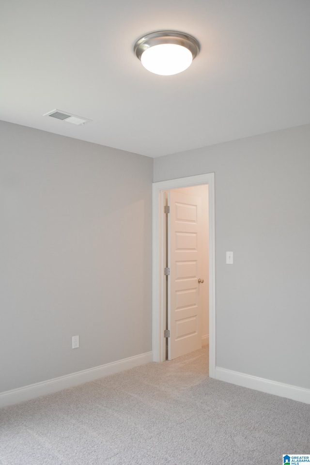 unfurnished room featuring carpet floors