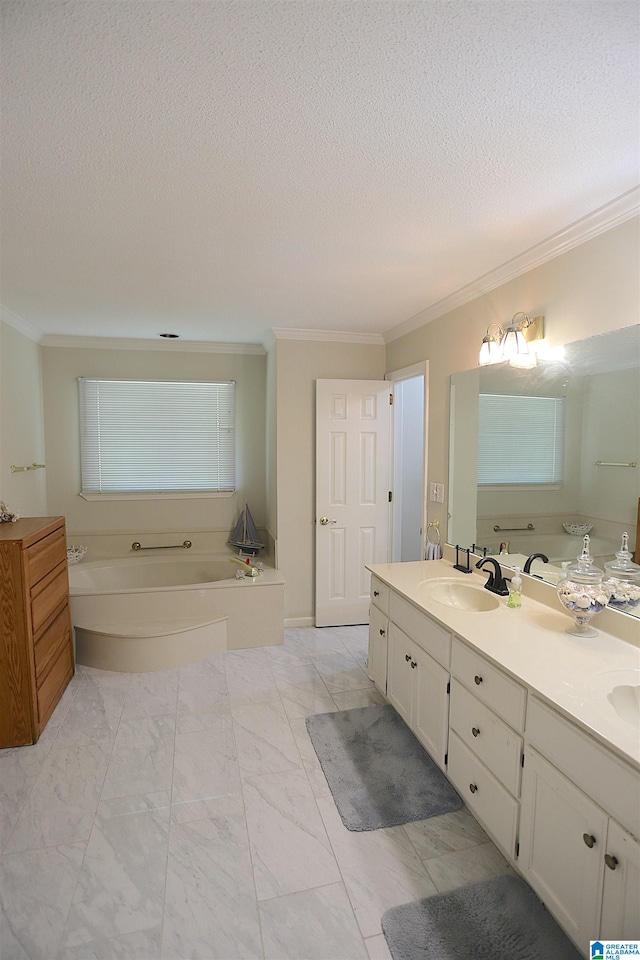 bathroom with a washtub, vanity, a textured ceiling, and ornamental molding