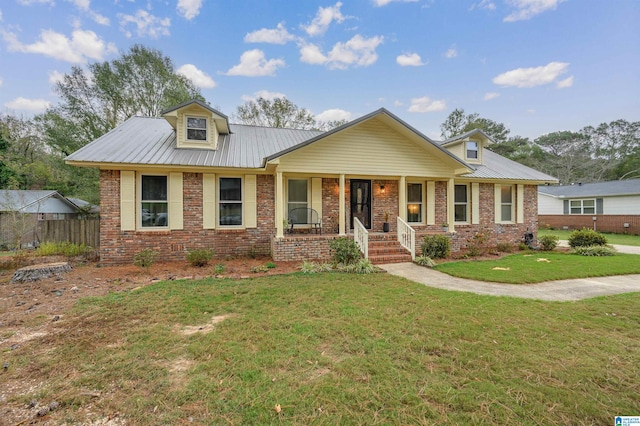 view of front of property with a porch and a front lawn