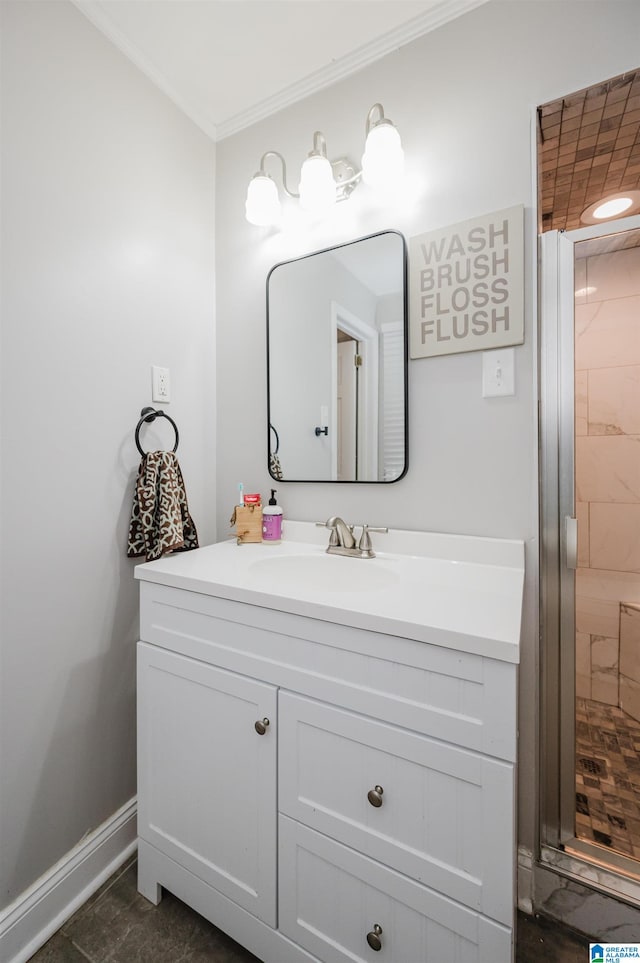 bathroom featuring vanity, a shower with shower door, and ornamental molding