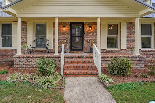 property entrance with covered porch