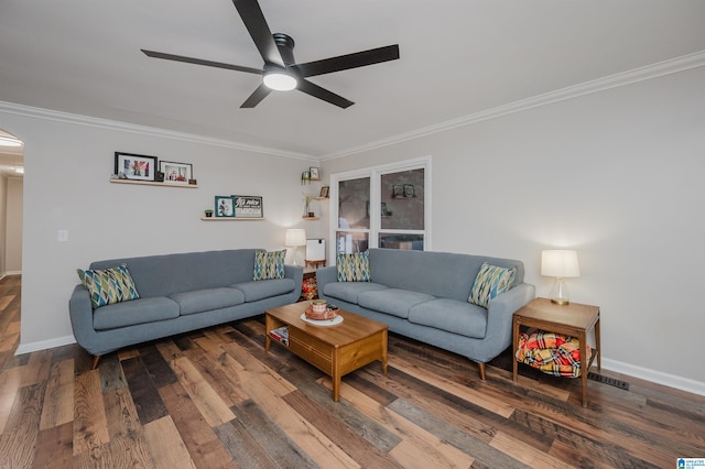 living room with ceiling fan, wood-type flooring, and ornamental molding