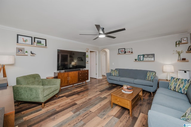 living room featuring hardwood / wood-style flooring, ceiling fan, and ornamental molding