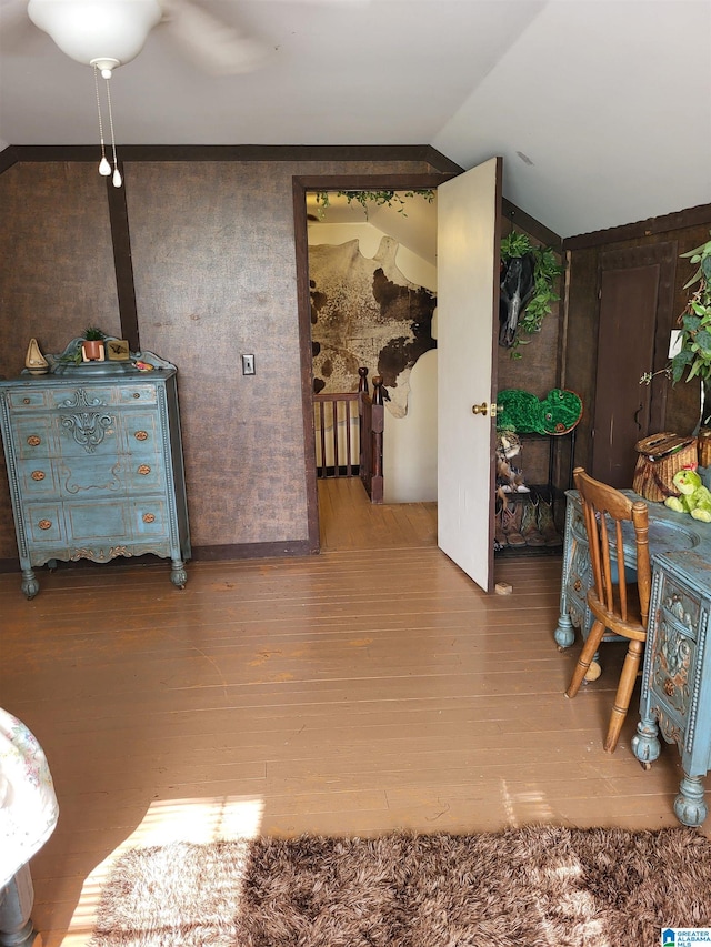 interior space with hardwood / wood-style floors and lofted ceiling