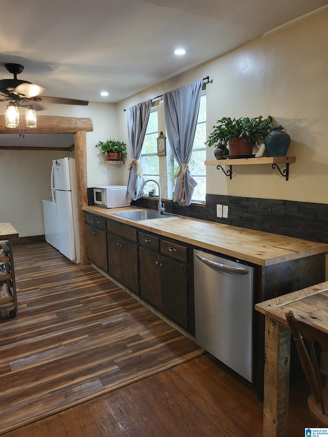 kitchen featuring butcher block counters, white appliances, sink, and dark wood-type flooring