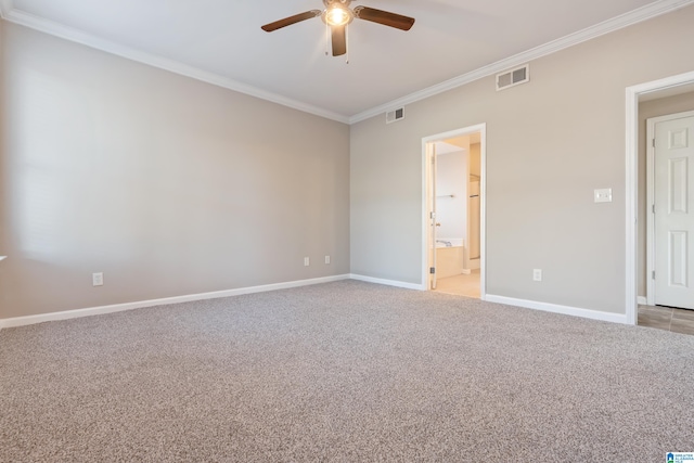 spare room with crown molding, ceiling fan, and light colored carpet