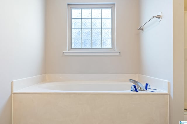 bathroom with a tub