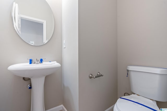 bathroom featuring toilet