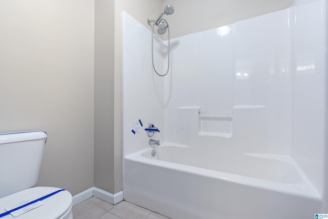 bathroom with tile patterned floors,  shower combination, and toilet