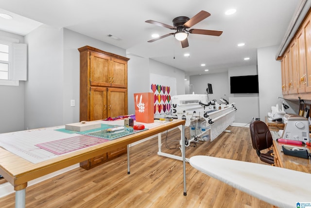 interior space featuring ceiling fan and light wood-type flooring