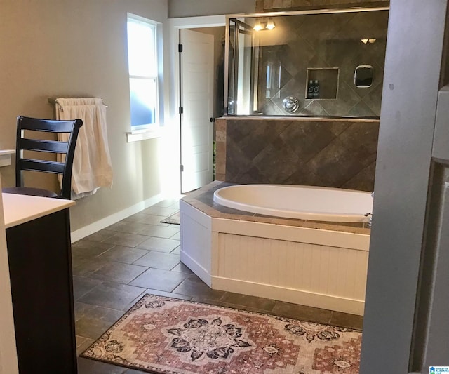 bathroom featuring tile patterned floors, vanity, and separate shower and tub