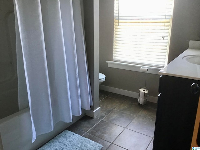 full bathroom with tile patterned flooring, vanity, shower / bath combination with curtain, and toilet