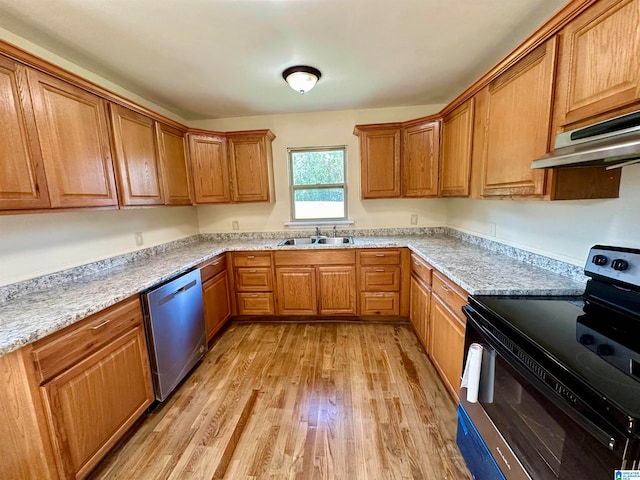 kitchen with dishwasher, sink, black / electric stove, light hardwood / wood-style floors, and light stone counters